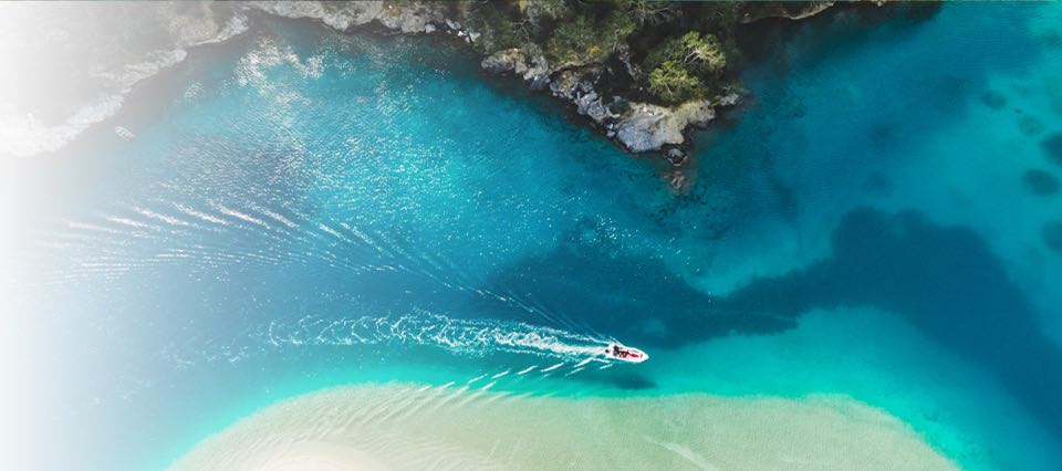 Boat floating near a beach