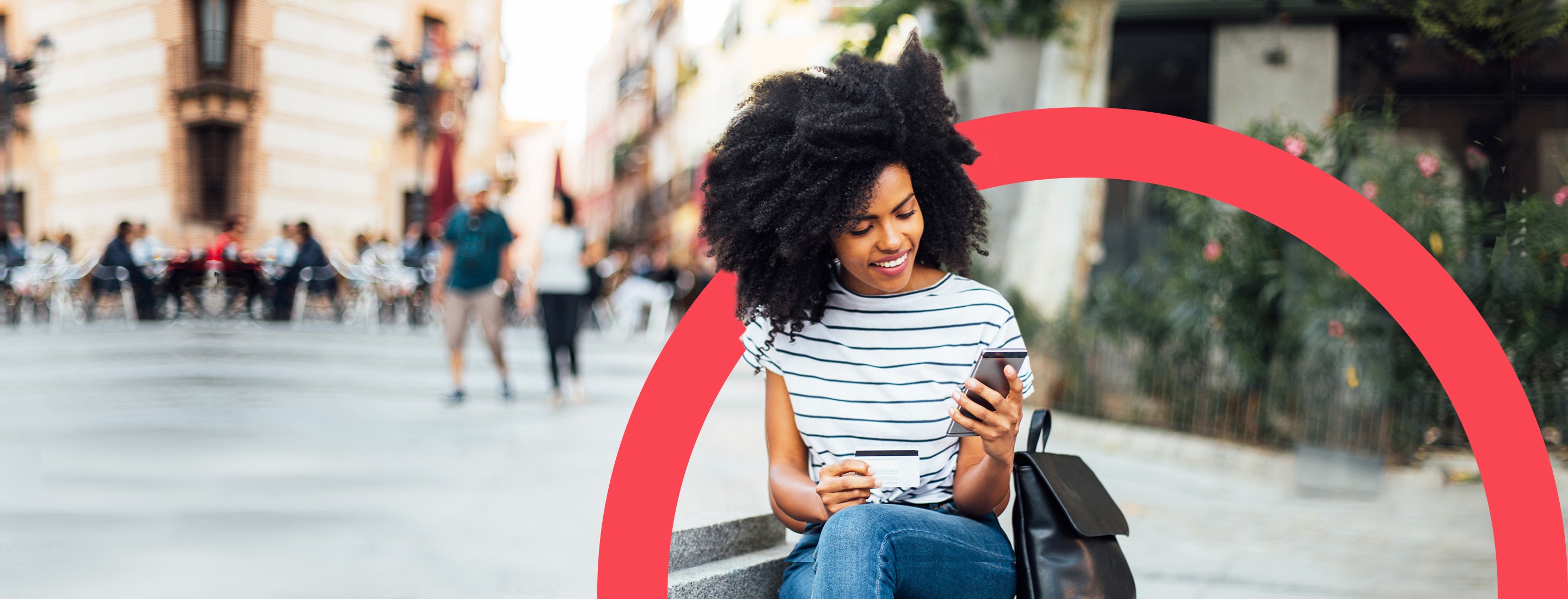 Woman in public space shopping on phone