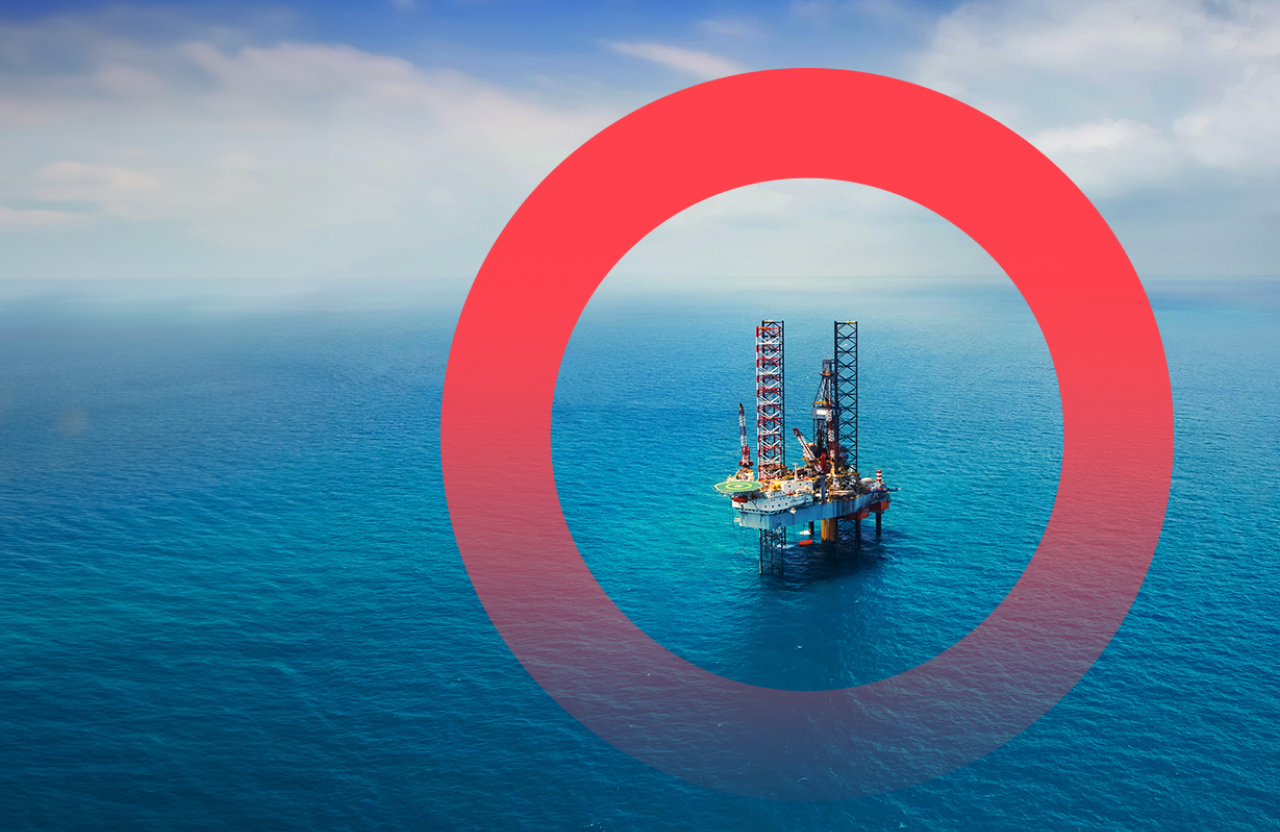 An oil and gas rig in the middle of the ocean.